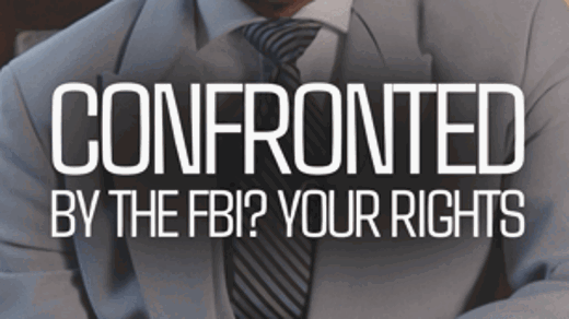 A Black man in a gray suit looks directly at the camera. Text overlay reads: "CONFRONTED BY THE FBI? YOUR RIGHTS."